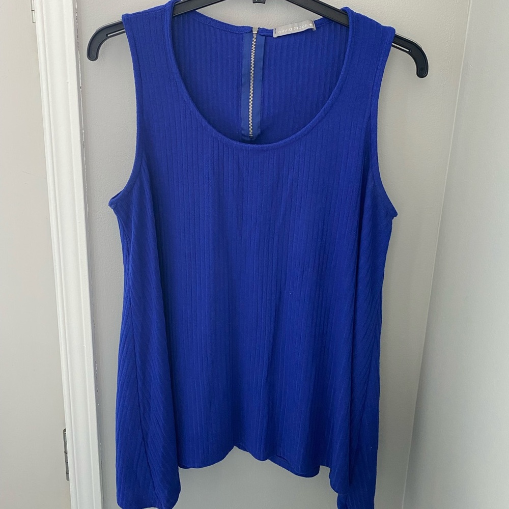Olivia Moon — Blue tank top with silver zip on the back.